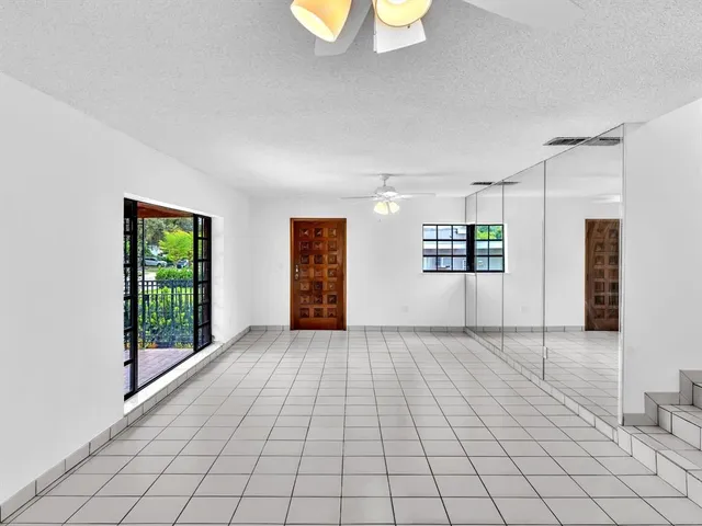 a view of an empty room and window