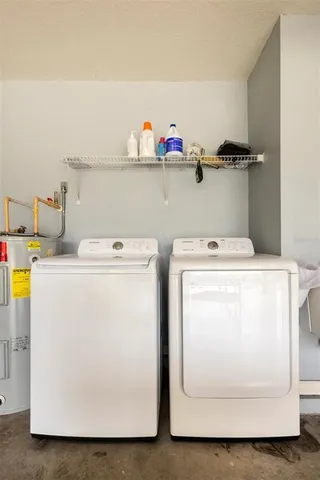 a utility room with dryer and washer