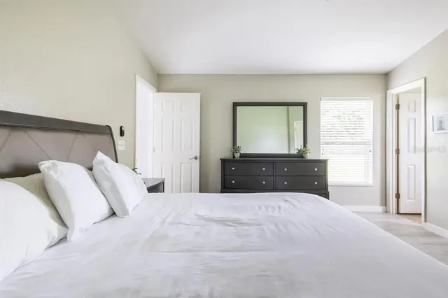 a bedroom with a bed and a closet