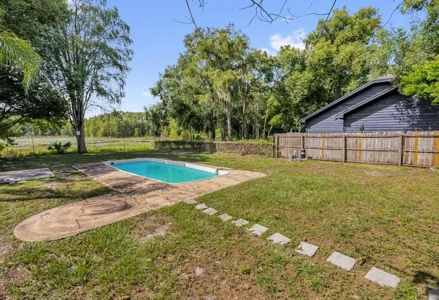 a view of a backyard with a garden