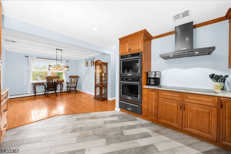 650 Woodglen Road Glen Gardner, NJ 08826 - Photo 8 of 28 a kitchen with stainless steel appliances granite countertop a refrigerator and stove top oven