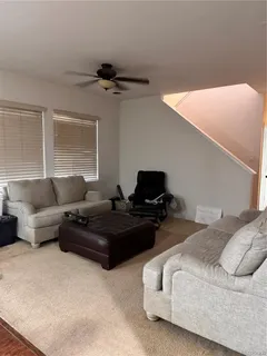 a bedroom with furniture and a couch