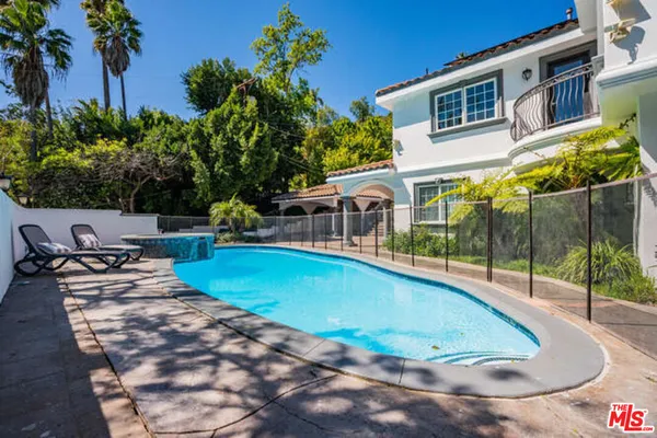 a view of a swimming pool with a patio