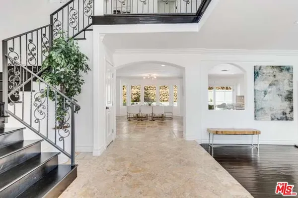 a view of a hallway view with staircase