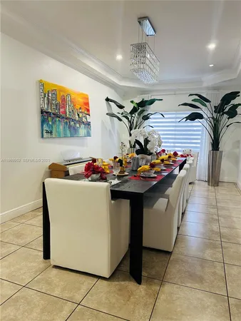 a hallway with table and chairs