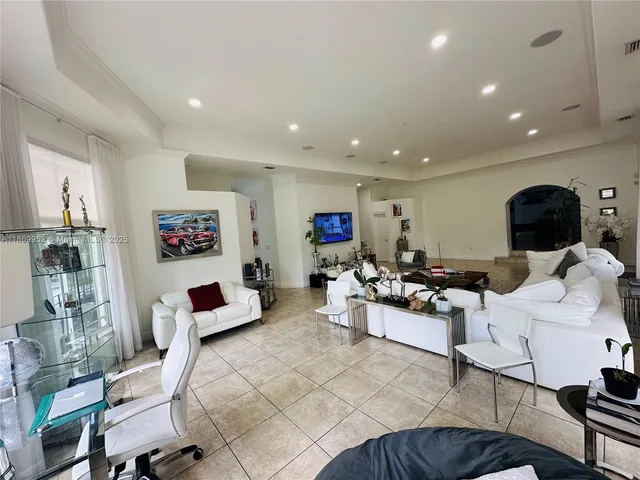 a room with stainless steel appliances a stove a sink and a counter top space