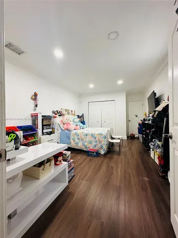 a room with furniture and a wooden floor