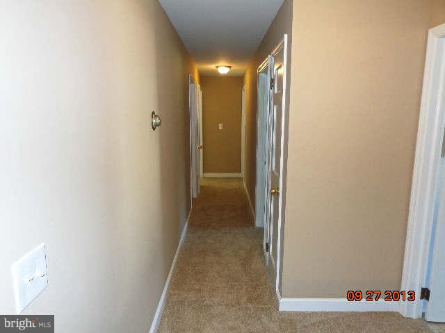 13126 Draper Road Clear Spring, MD 21722 - Photo 17 of 30 a view of a hallway with wooden floor