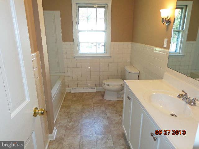 13126 Draper Road Clear Spring, MD 21722 - Photo 18 of 30 a bathroom with a sink a toilet and a bathtub