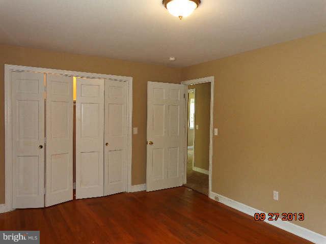 13126 Draper Road Clear Spring, MD 21722 - Photo 26 of 30 a view of an empty room with wooden floor
