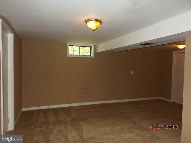 13126 Draper Road Clear Spring, MD 21722 - Photo 28 of 30 an empty room with a window and a ceiling fan