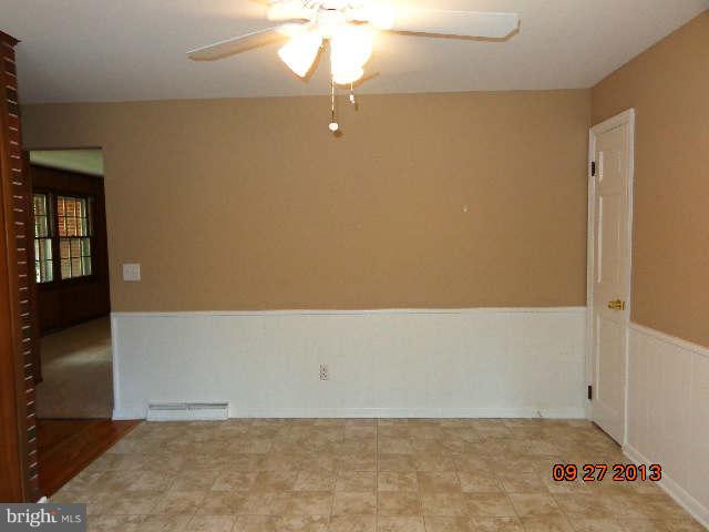 13126 Draper Road Clear Spring, MD 21722 - Photo 9 of 30 an empty room with a ceiling fan
