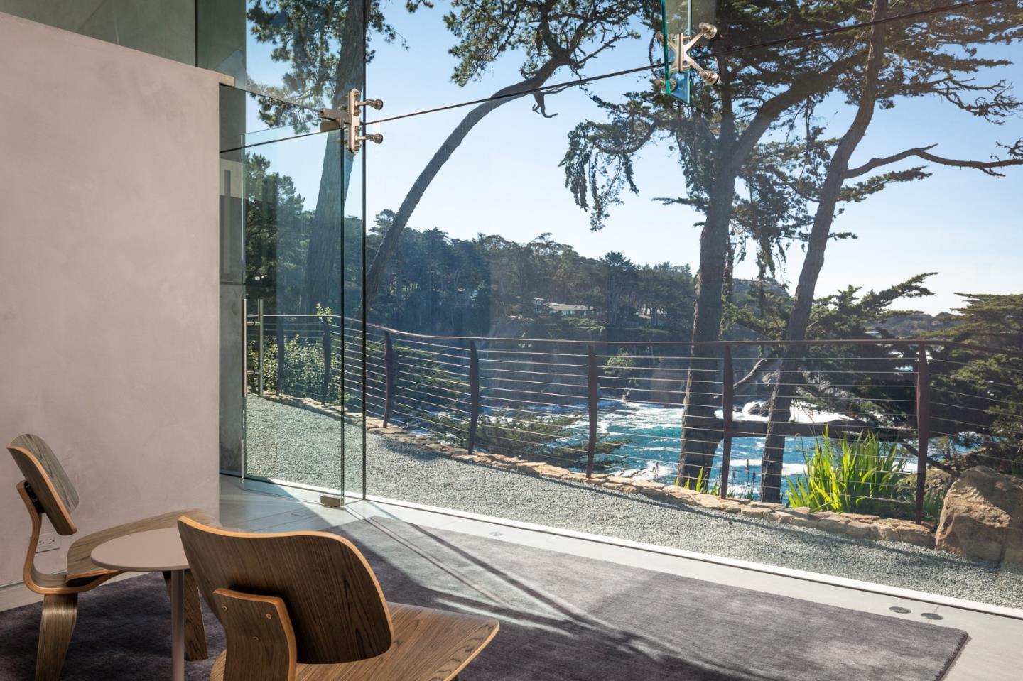 243 Highway 1 Carmel, CA 93923 - Photo 12 of 20 a view of a chairs and table in the back yard
