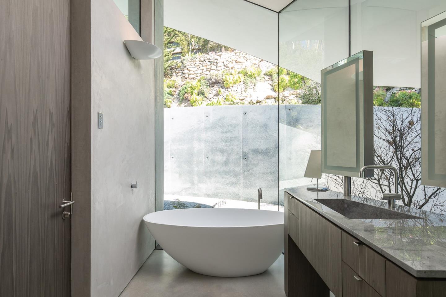 243 Highway 1 Carmel, CA 93923 - Photo 17 of 20 a bathroom with a granite countertop bathtub and shower