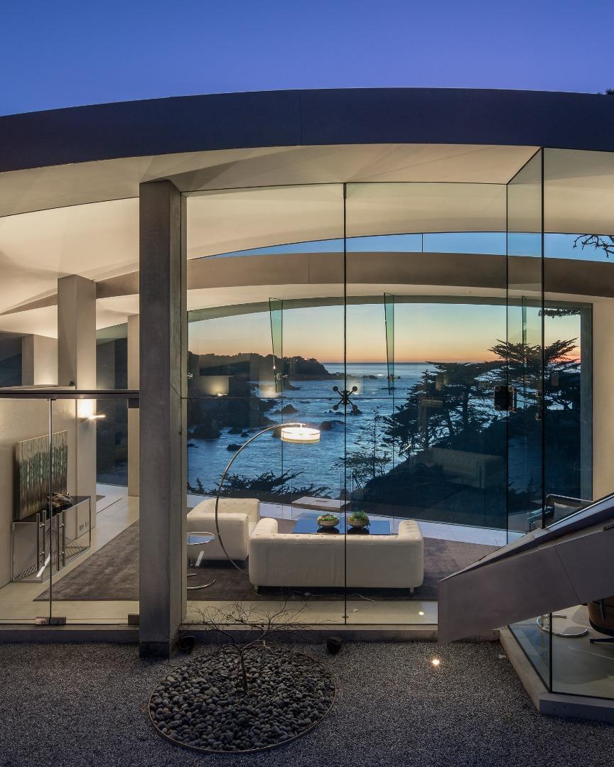 243 Highway 1 Carmel, CA 93923 - Photo 19 of 20 a room with a floor to ceiling window and potted plants