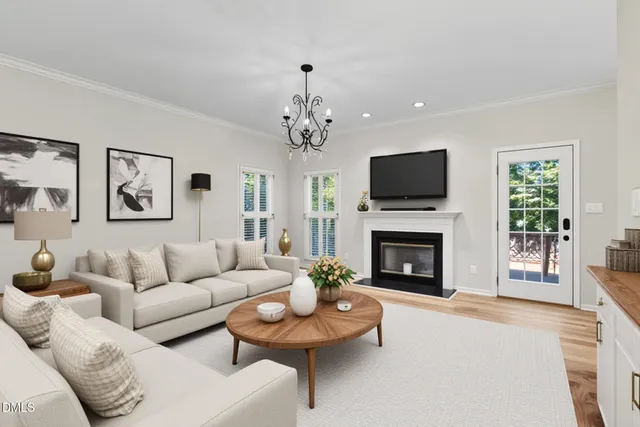 a living room with furniture fireplace and flat screen tv