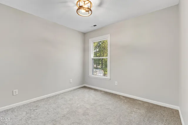 a spacious bathroom with a granite countertop sink mirror and bathtub