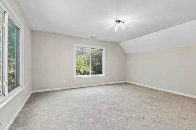 a view of balcony with wooden floor and fence