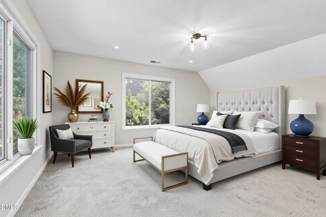 a view of a house with a yard and deck