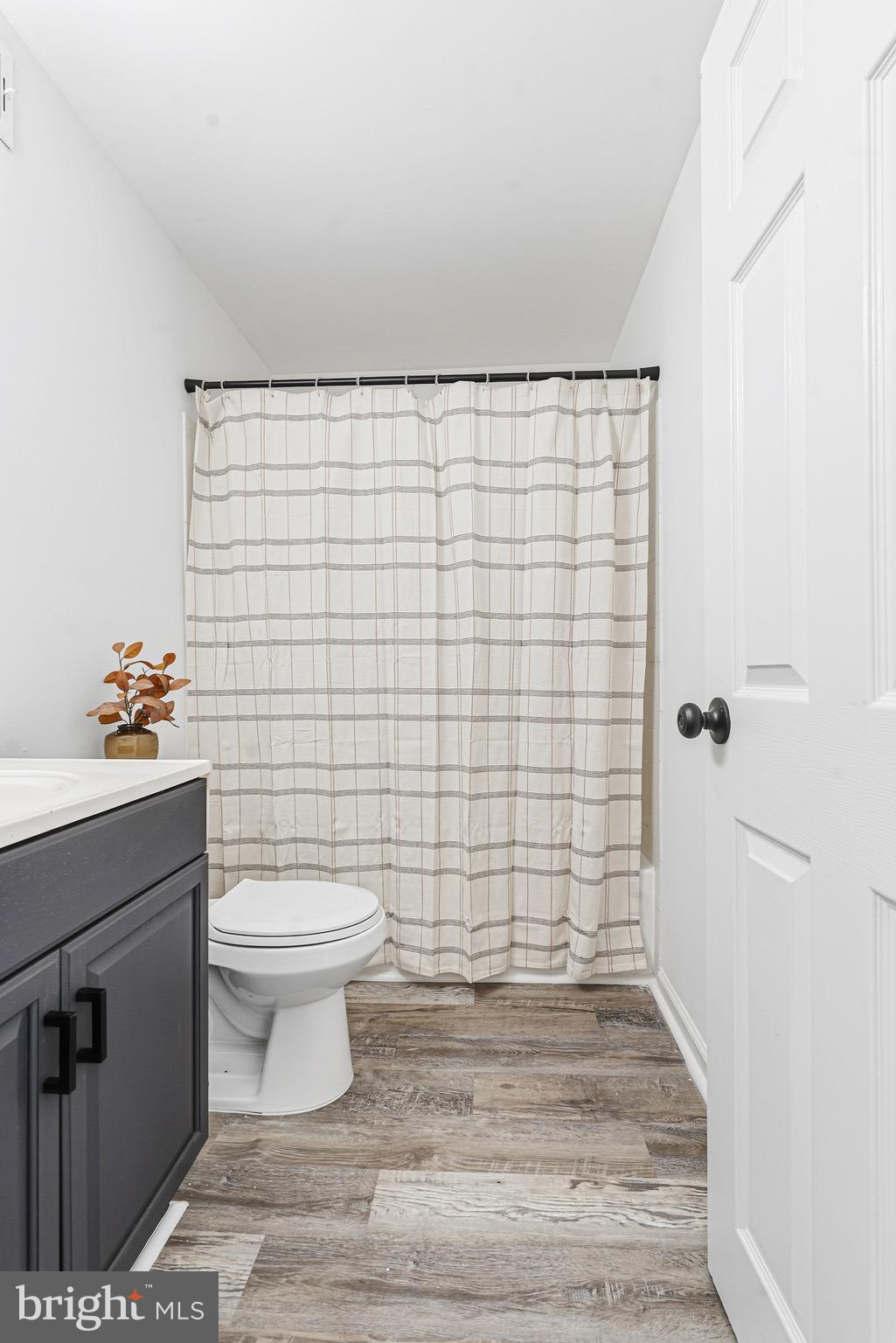 8110 North Boundary Road Dundalk, MD 21222 - Photo 12 of 24 a bathroom with a toilet and a shower