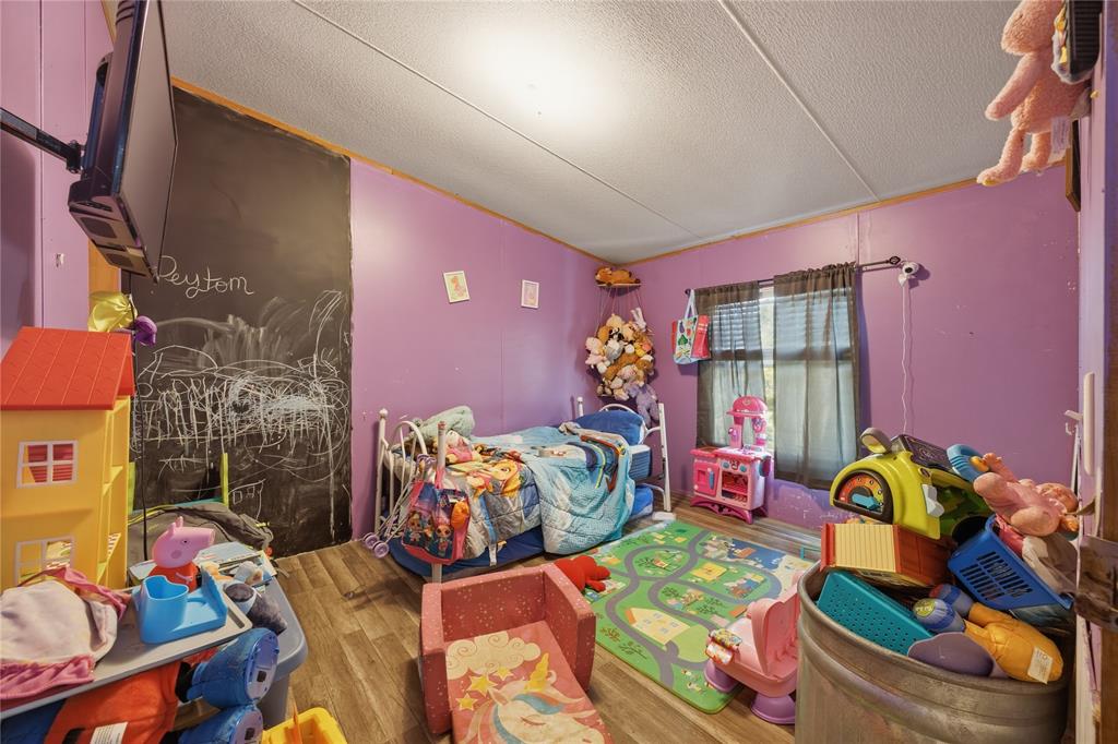 2449 East Fm 120 Denison, TX 75021 - Photo 29 of 30 a bed room with furniture and a couch
