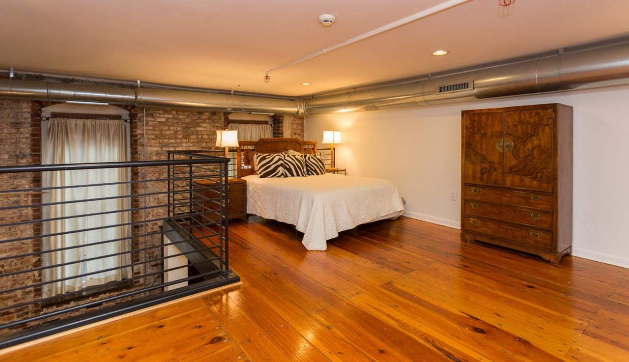 50 Gayoso Avenue, Unit 306 Memphis, TN 38103 - Photo 19 of 25 a bedroom with a bed and closet