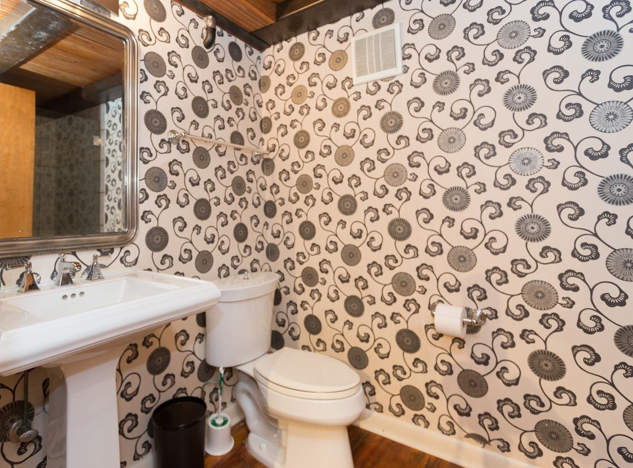 50 Gayoso Avenue, Unit 306 Memphis, TN 38103 - Photo 10 of 25 a bathroom with a sink and mirror with toilet