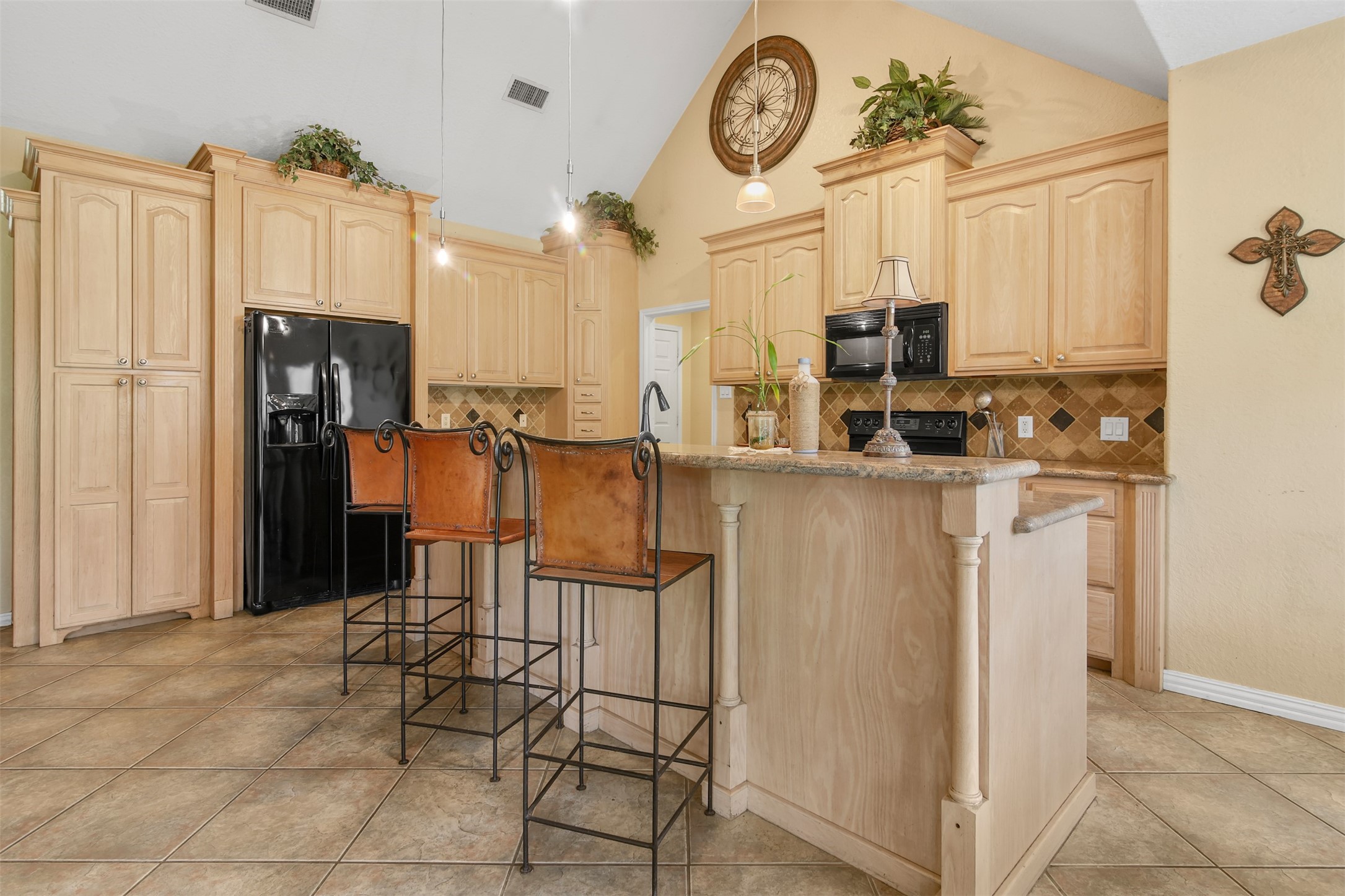 11692 Clark Lane Conroe, TX 77385 - Photo 8 of 35 The kitchen is open to the family room which is perfect for entertaining.