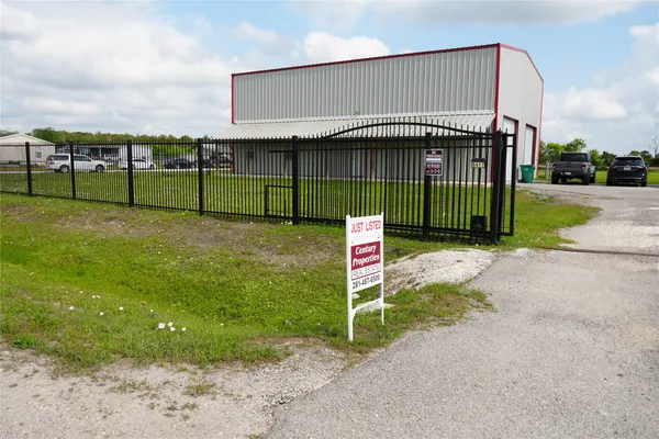 a sign board with a yard