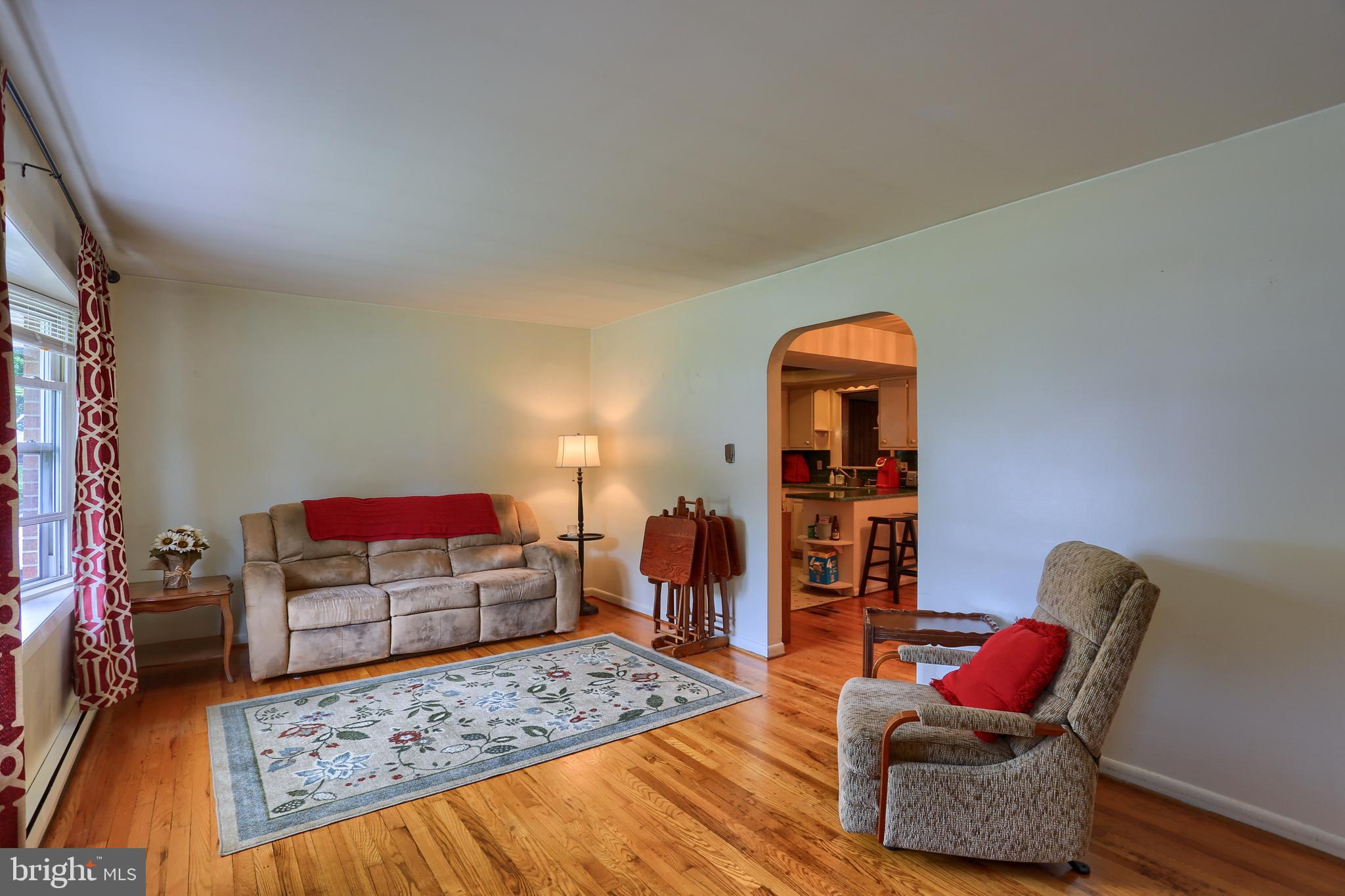 Living room with bay window and hardwood floors