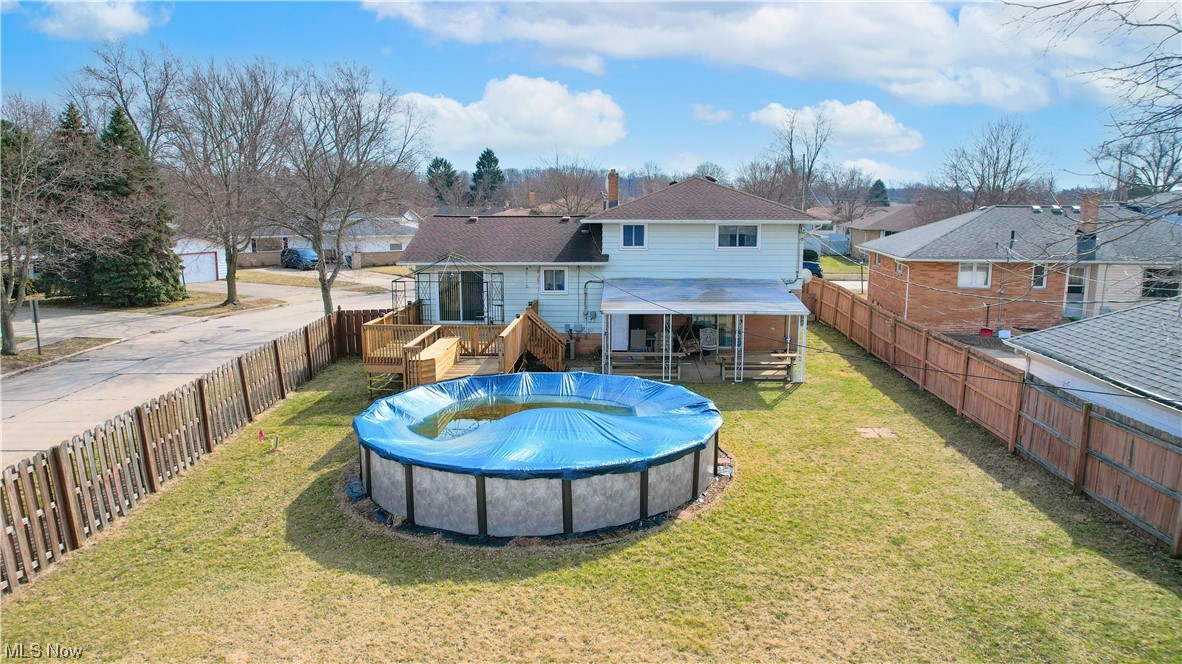 7094 Brandywine Road Parma Heights, OH 44130 - Photo 3 of 49 Back of property featuring a pool side deck and a yard