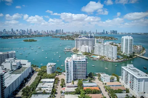 a view of a lake with tall buildings