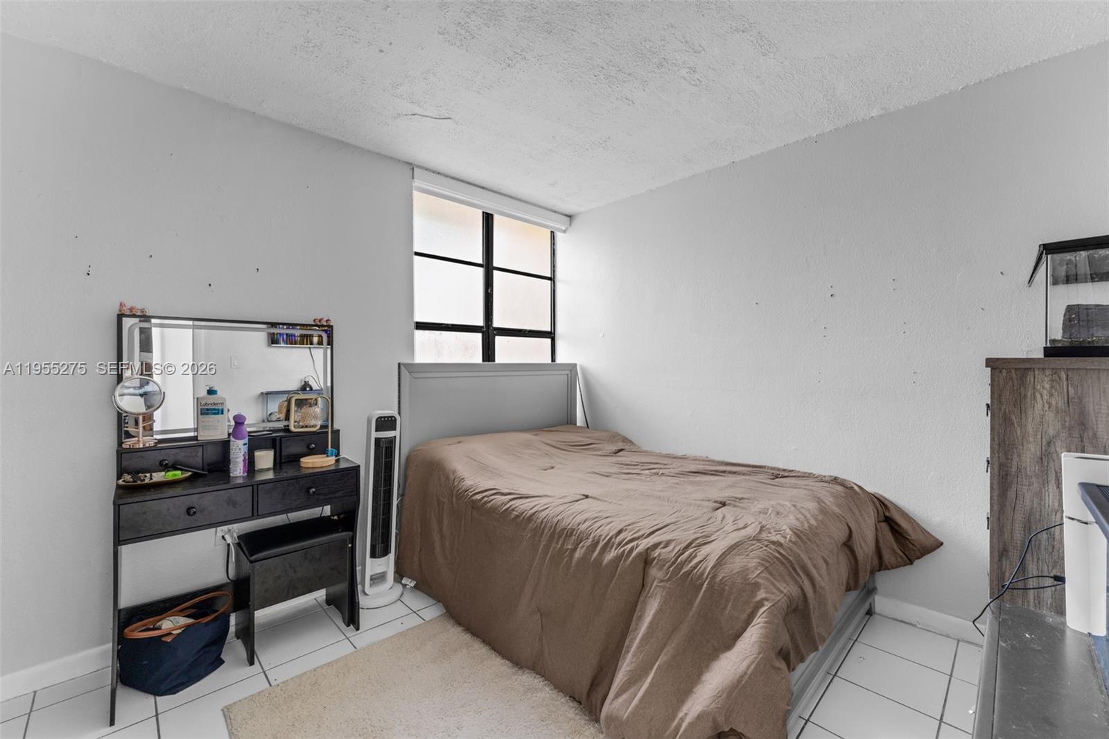 20033 Southwest 123rd Drive Miami, FL 33177 - Photo 11 of 22 a bedroom with a bed and a window