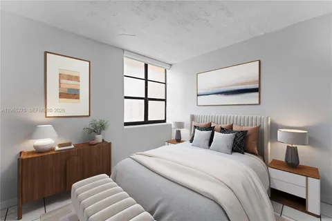 a bedroom with bed and a window