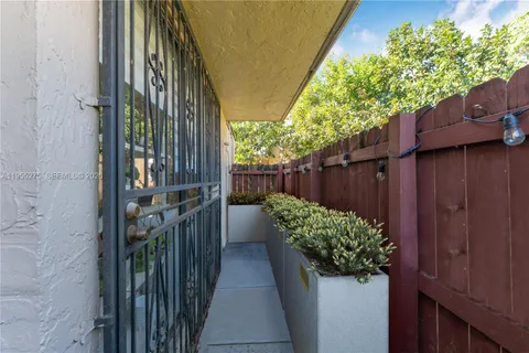 a view of a pathway along with wooden fence