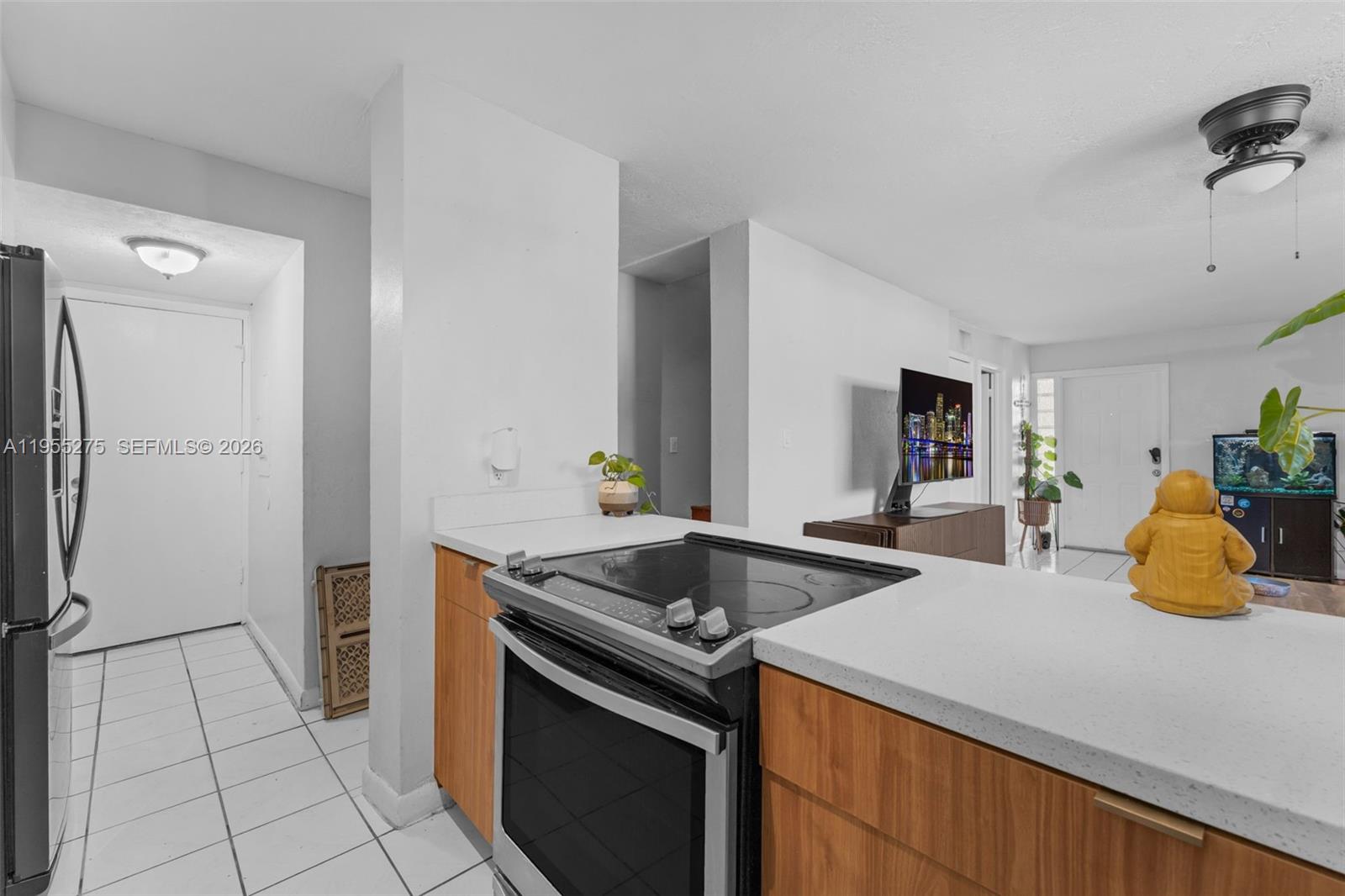 20033 Southwest 123rd Drive Miami, FL 33177 - Photo 4 of 22 a kitchen with stainless steel appliances granite countertop a sink and a stove