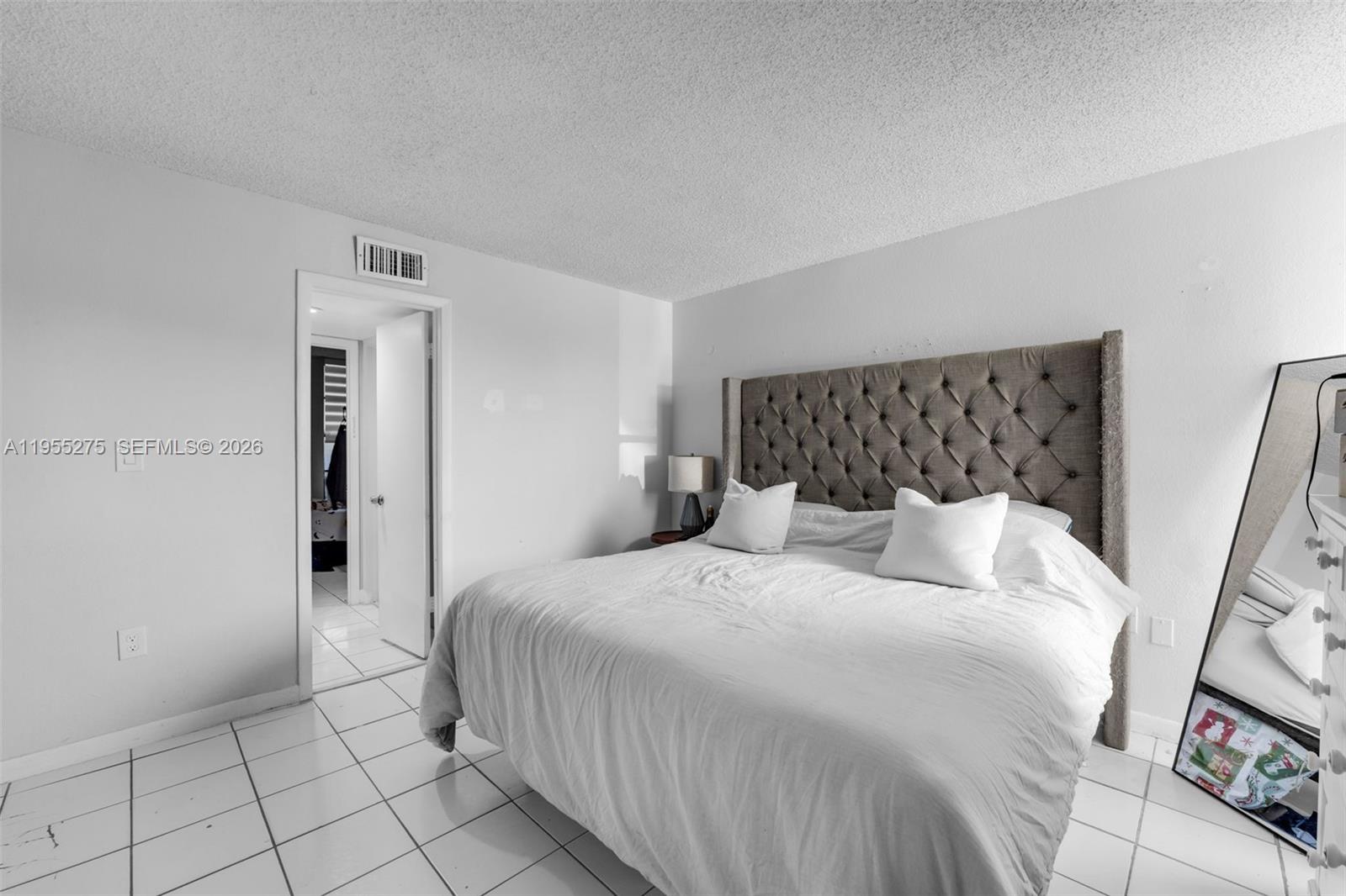 20033 Southwest 123rd Drive Miami, FL 33177 - Photo 6 of 22 a bedroom with a bed and a window