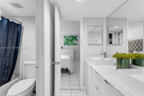 a spacious bathroom with a sink a toilet and shower