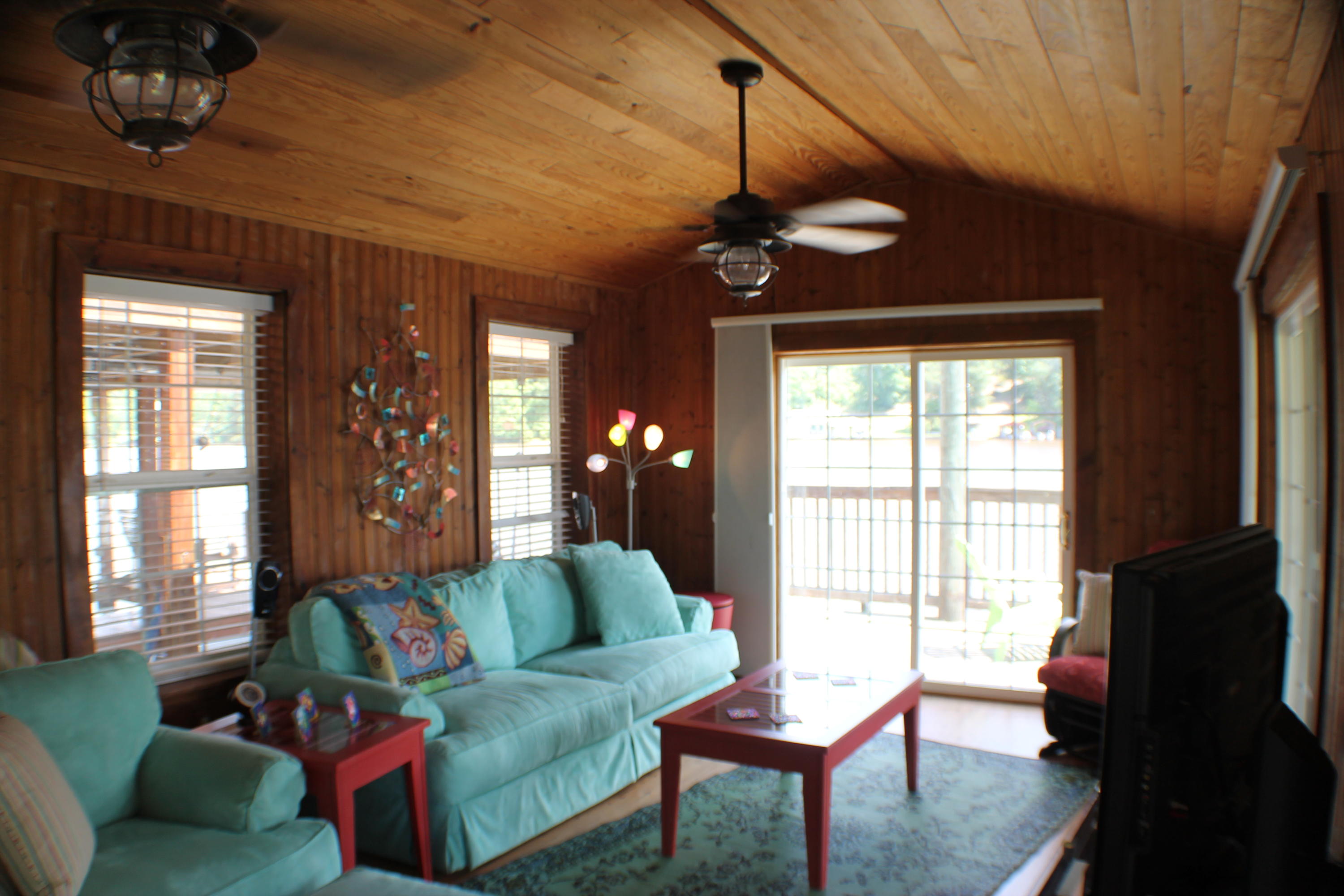 15383 Pier 7 Road Andalusia, AL 36421 - Photo 54 of 58 a living room with furniture a ceiling fan and a window