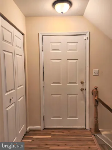 wooden floor with white cabinet