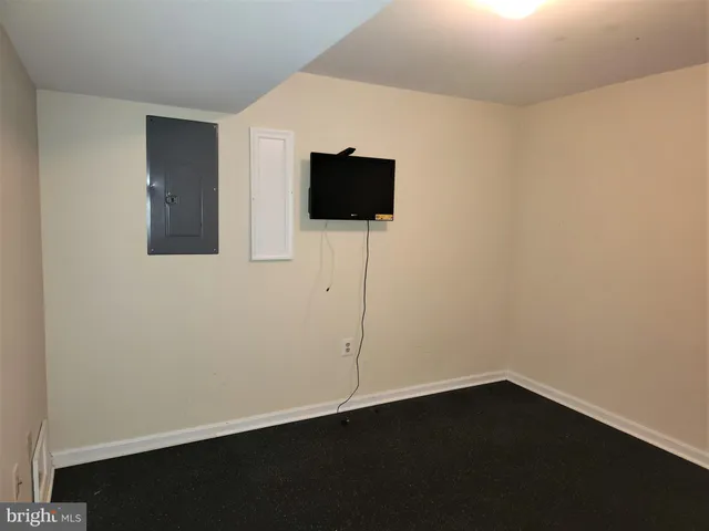 a view of balcony with wooden floor and iron stairs