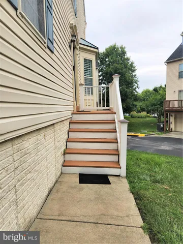 a view of a house with a yard and a garden