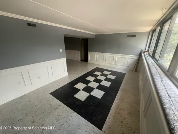 a view of a hardwood floor and staircase in a kitchen