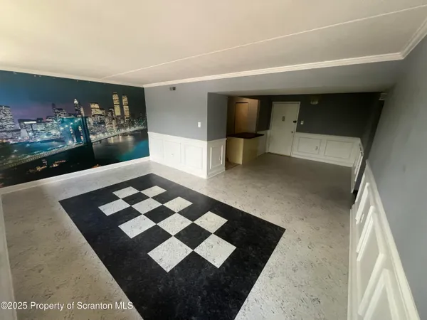 a living room with furniture and dining area