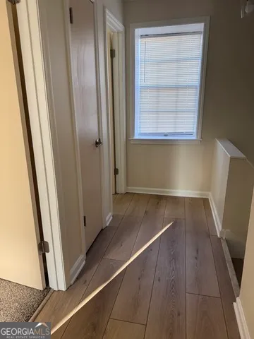 a view of front door with wooden floor