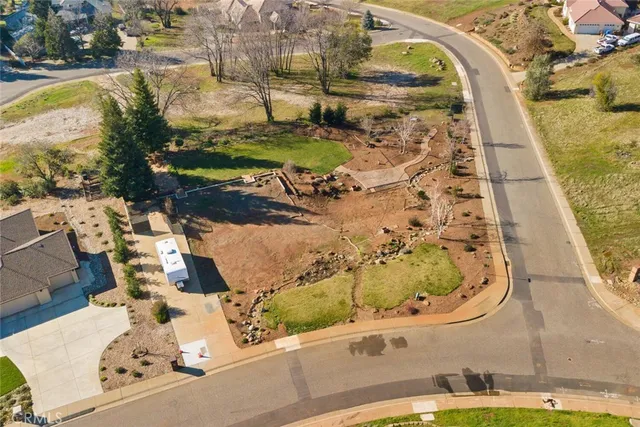 a view of a swimming pool with a yard