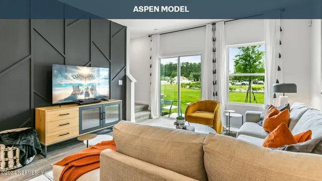 a living room with furniture and a table