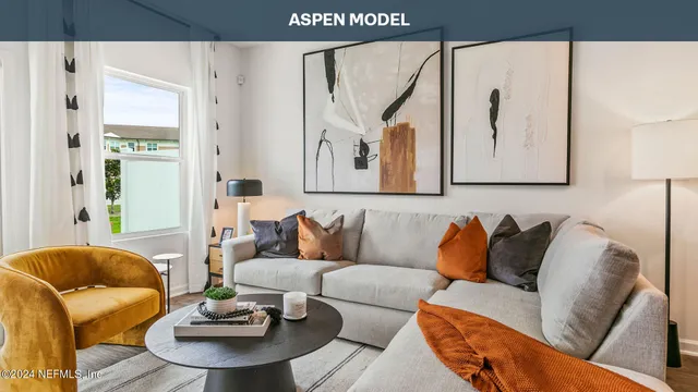 a living room with furniture and a painting