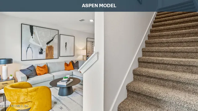 a view of a living room and dining room