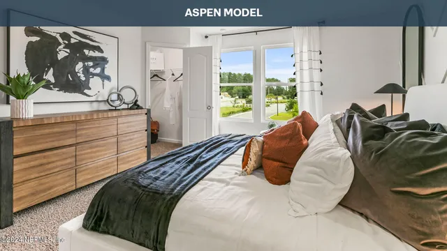 a view of a room that has a bed